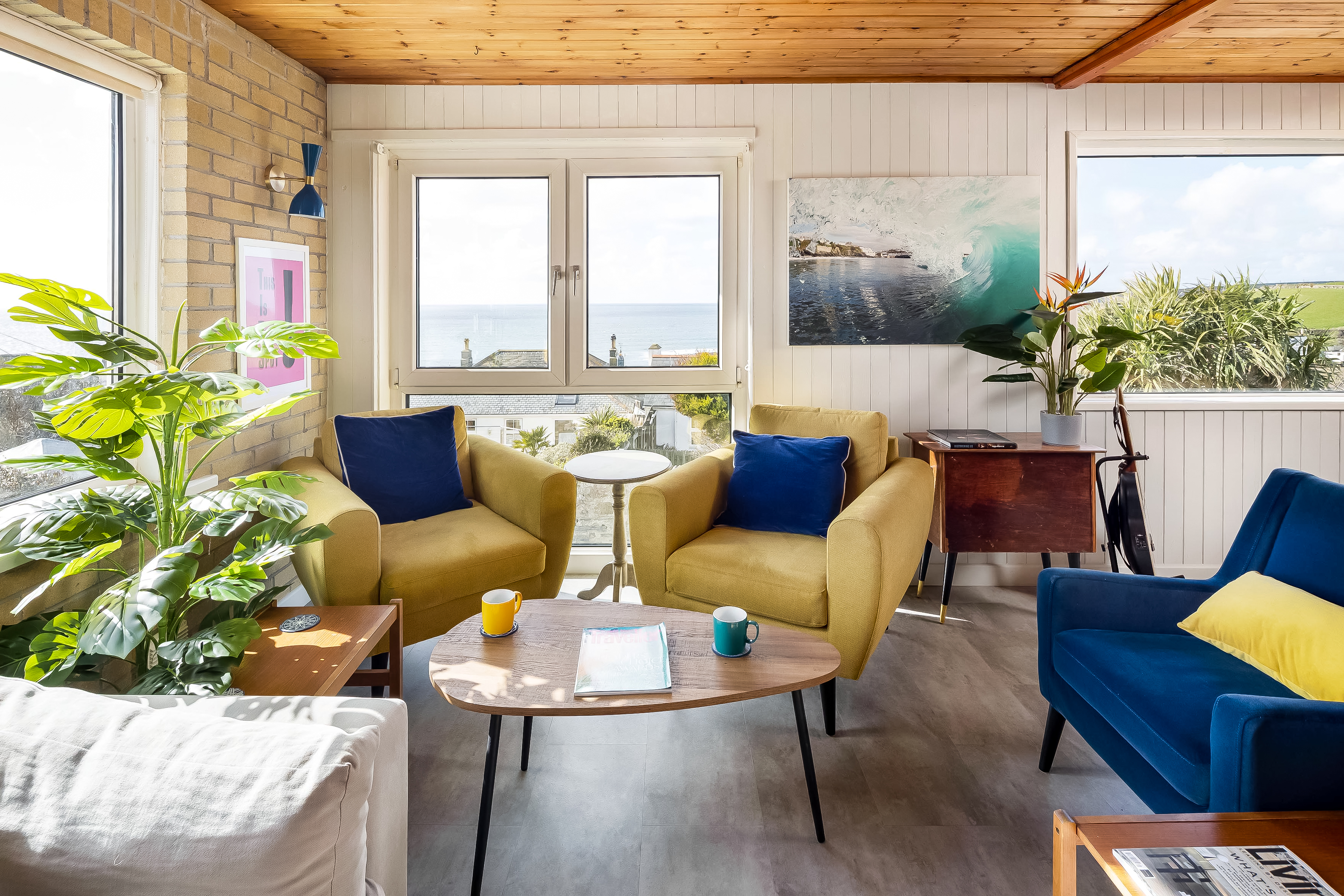 Dining table set for dinner with sea view backdrop