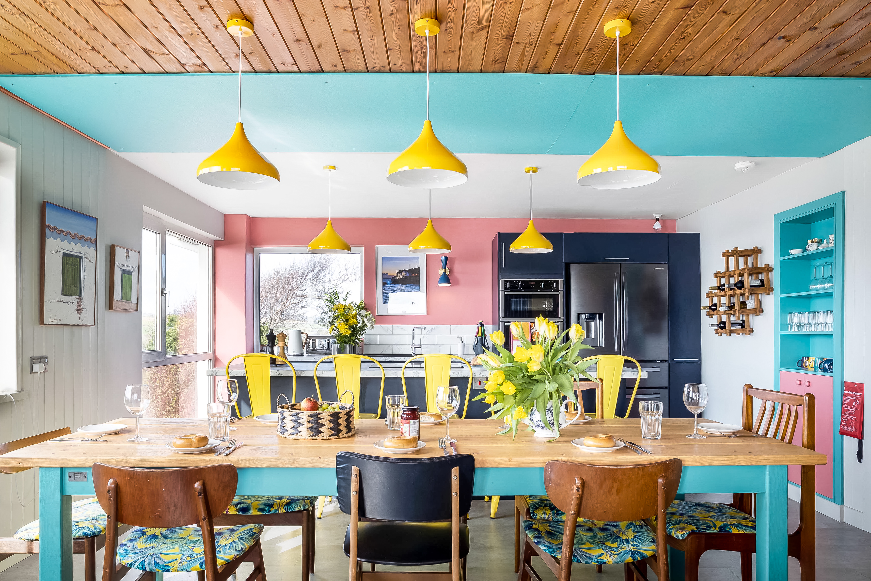 Modern kitchen with marble island, professional oven and ocean views